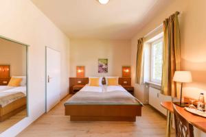 Postel nebo postele na pokoji v ubytování Boardinghouse Pfarrkirchen