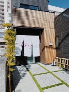 a towel hanging on a clothes line on a building at Ixyz杜 in Nagoya