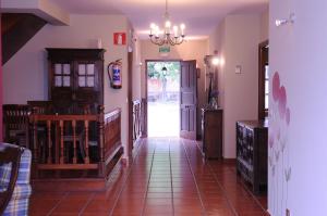 a hallway of a house with a staircase and a door at Bekoabadene in Menaka