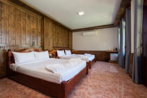 Postel nebo postele na pokoji v ubytování Koh Tao Relax Freedom Beach Resort