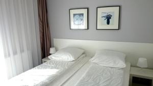 Posteľ alebo postele v izbe v ubytovaní Willa Długa No. 4 Bed & Breakfast