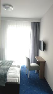 Televízia a/alebo spoločenská miestnosť v ubytovaní Willa Długa No. 4 Bed & Breakfast