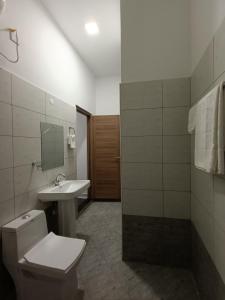 a bathroom with a toilet and a sink at City Centre in Mombasa