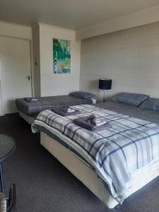 a bedroom with two beds in a room at Neerim South Hotel in Neerim South