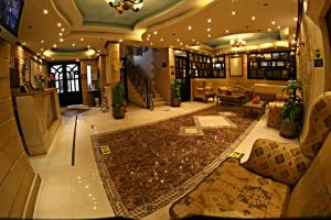 a large living room with a couch and a table at Luxor Hotel Hurghada in Hurghada