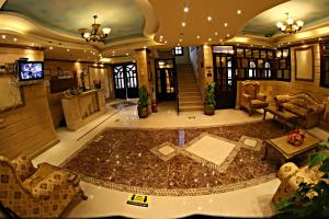 a large living room with a large rug at Luxor Hotel Hurghada in Hurghada