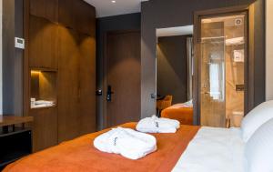 Letto o letti in una camera di Bridge Hotel