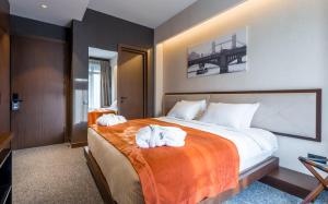 Ένα ή περισσότερα κρεβάτια σε δωμάτιο στο Bridge Hotel