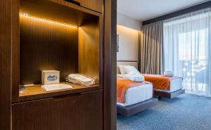 Letto o letti in una camera di Bridge Hotel