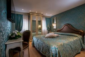 A bed or beds in a room at Ca' Marinella