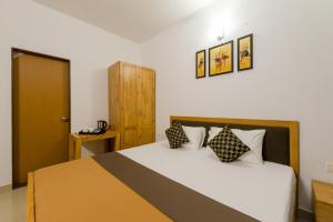 Posteľ alebo postele v izbe v ubytovaní Aashirwad Serviced Residences