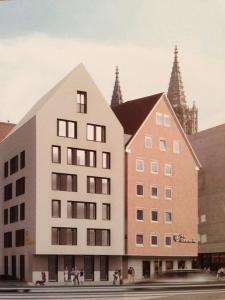a rendering of a building with people walking in front of it at Hotel Goldenes Rad in Ulm