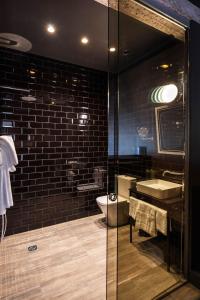 
a bathroom with a sink and a mirror at Urban Suite Santander in Santander
