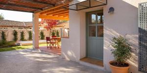 a front door of a house with a patio at La Alberca Casa con jardín y piscina in Tenzuela
