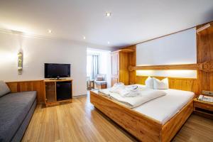 Säng eller sängar i ett rum på Sport- und Vitalhotel Seppl
