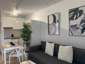 a living room with a gray couch and a table at Holyhome premium 112 in Costa Teguise