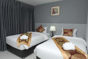 Ένα ή περισσότερα κρεβάτια σε δωμάτιο στο Top High Airport Link Hotel, Bangkok