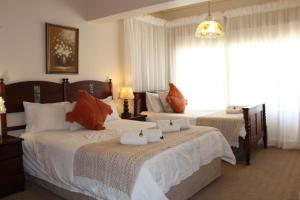 Katil atau katil-katil dalam bilik di Florentia Guest House