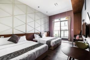 Giường trong phòng chung tại Toutsu Asami Guest House