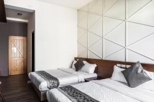 Giường trong phòng chung tại Toutsu Asami Guest House