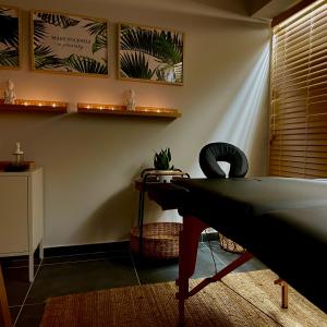 a living room with a ping pong table and plants at Athenian Riviera Hotel& Suites in Athens