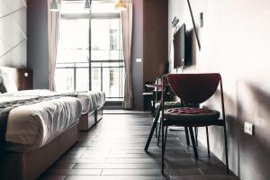 Giường trong phòng chung tại Toutsu Asami Guest House