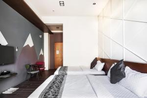 Giường trong phòng chung tại Toutsu Asami Guest House