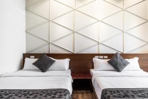 Giường trong phòng chung tại Toutsu Asami Guest House