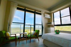 Cama o camas de una habitación en 嵵裡仙人掌海景民宿Ocean view room