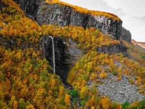 a waterfall on the side of a mountain at Sorrisniva Arctic Wilderness Lodge in Alta