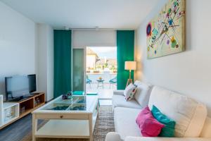 Televízia a/alebo spoločenská miestnosť v ubytovaní Veoapartment Ponce León
