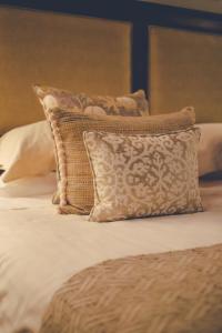 A bed or beds in a room at Capannelle Wine Resort