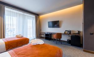Letto o letti in una camera di Bridge Hotel