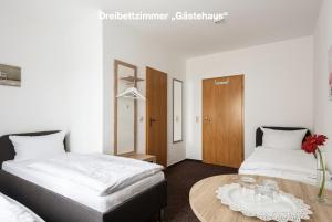 Postel nebo postele na pokoji v ubytování Gutshof Havelland