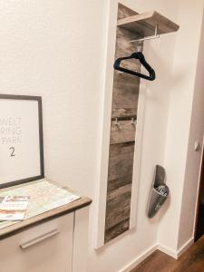 a room with a closet with a wooden door at Ferienwohnung Paula Winterberg in Winterberg +21 photos