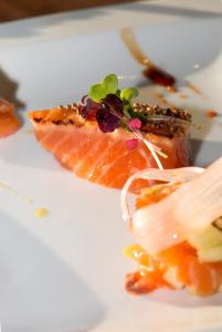 a white plate with a piece of food on it at O Petit Monde in Sanary-sur-Mer +33 photos