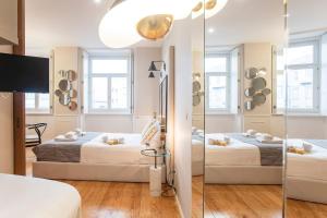 En eller flere senger på et rom på Cute & Bright Flat w/ AC by LovelyStay