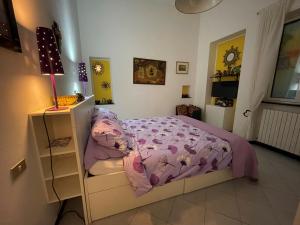 a bedroom with a bed and a book shelf at RAPALLO centro storico a due passi dal mare con ascensore in Rapallo