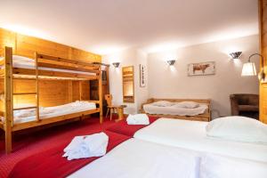 Postel nebo postele na pokoji v ubytování L'Alpage