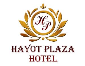 a golden logo for a hotel with a laurel wreath at Hayot Plaza Hotel in Yunusobod