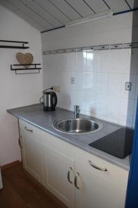 Kuchyň nebo kuchyňský kout v ubytování Haus Lina + 33 fotografií