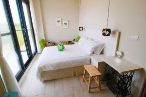 Cama o camas de una habitación en 嵵裡仙人掌海景民宿Ocean view room