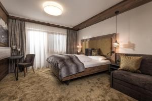 Letto o letti in una camera di Hotel Edenlehen