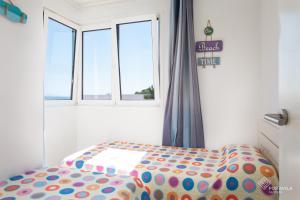 A bed or beds in a room at Tamarells 11