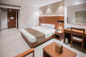 Postel nebo postele na pokoji v ubytování Hotel Niya Regency