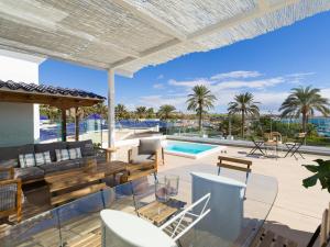 an outdoor living room with a patio and a swimming pool at Pasitoblanco Porto Mare 45 Seaview Villa prívate heated pool in Pasito Blanco