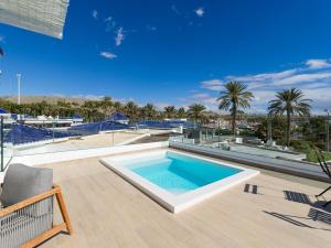 a swimming pool on the roof of a house at Pasitoblanco Porto Mare 45 Seaview Villa prívate heated pool in Pasito Blanco +36 photos