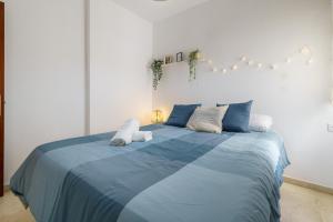 Posteľ alebo postele v izbe v ubytovaní PUERTA DEL MAR APARTMENT