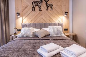 Łóżko lub łóżka w pokoju w obiekcie Białka Residence Ski Powidoki