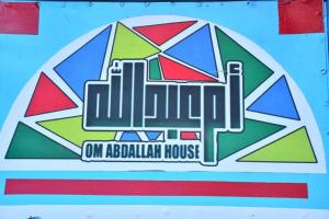 a logo for an aboriginal house on a building at Om-Abdallah in Aswan